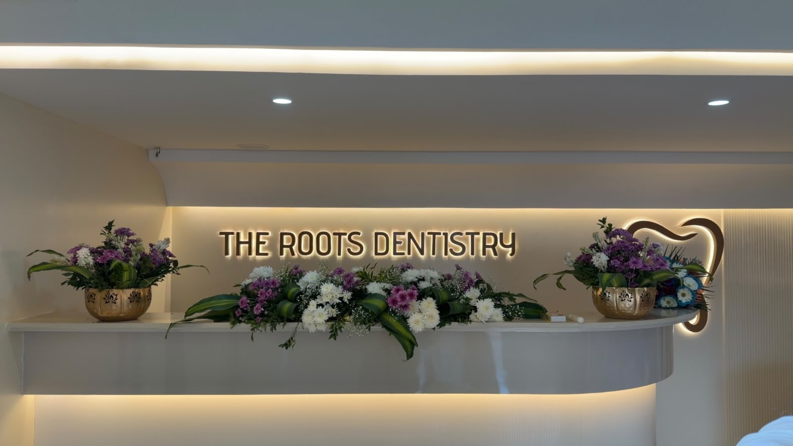 A wide view of the reception area at The Roots Dentistry, Kanakapura Road